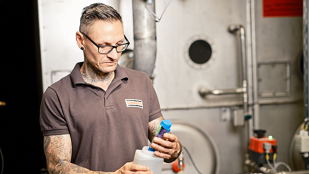 Photo of employee checking the water quality