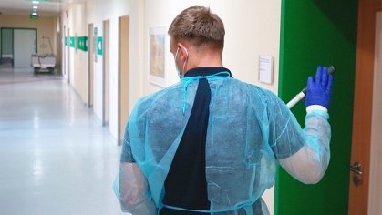 Picture of a cleaner in a protective suit in a clinic