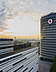 Photo of a building with Vodafone logo, in front of a sunset with clouds