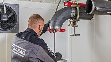 Picture of a man working on a pipe