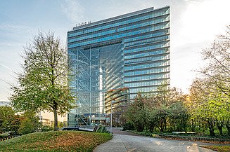 Photo of a glass building formed like a gate