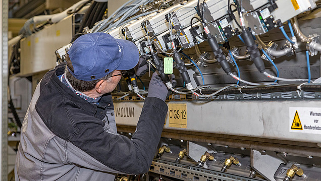 Picture of a man repairing an installation