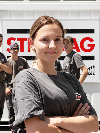 Photo of trainees in front of a container